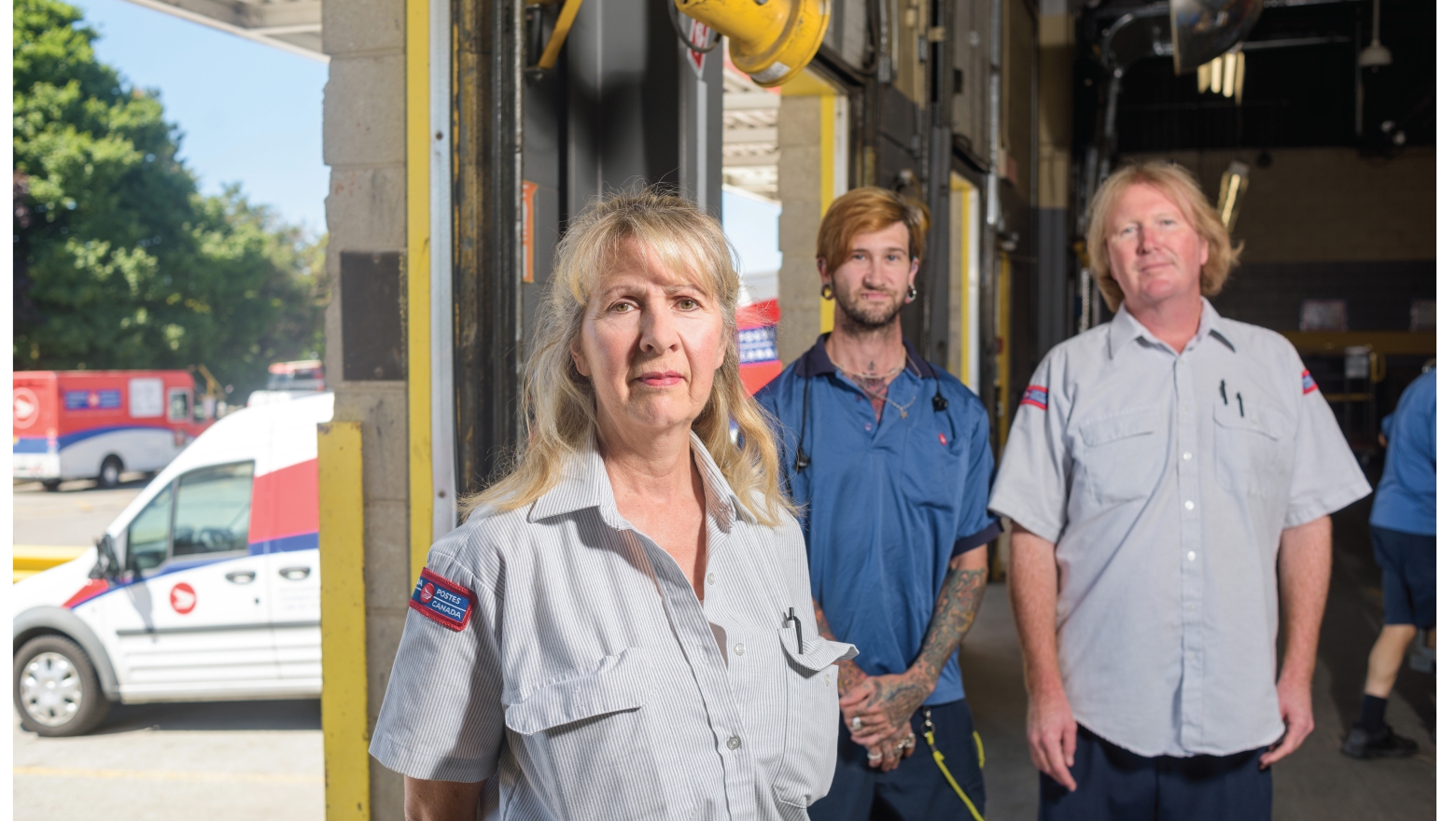 Image of POstal workers in a warehouse 